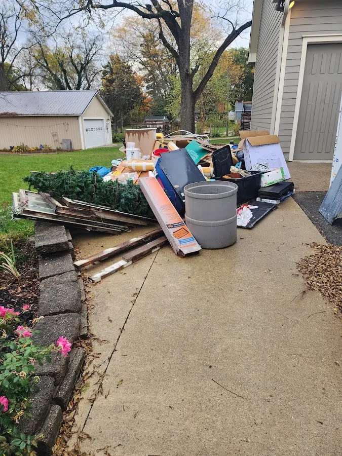 Dumpster being loaded with debris for Demolition Dumpster Rental in Kingwood